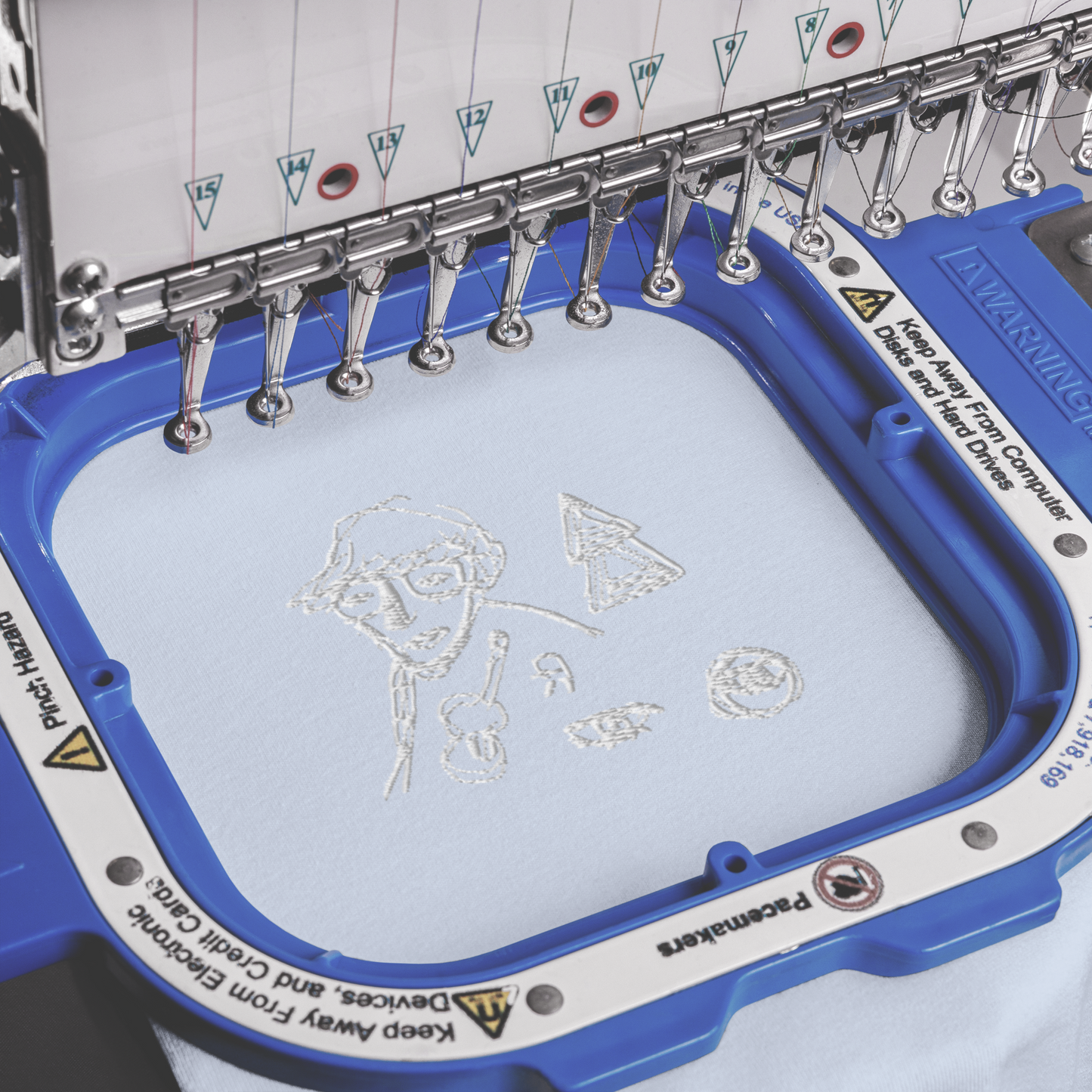 white embroidery on baby blue t-shirt